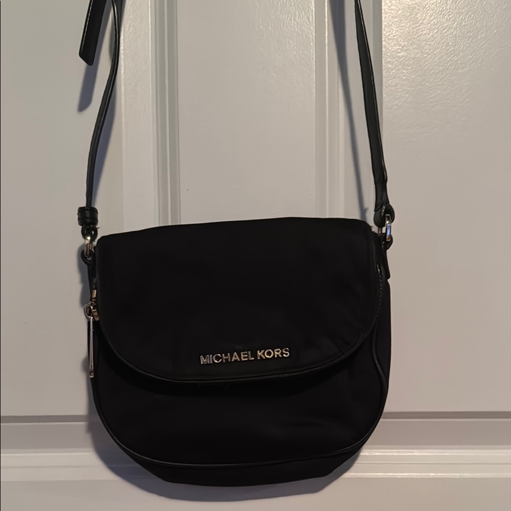 Michael Kors Black Crossbody Bag with Adjustable Strap and Flap Closure